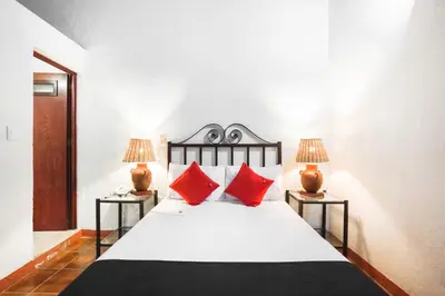 Cama o camas de una habitación en Capital O El Nito Posada
