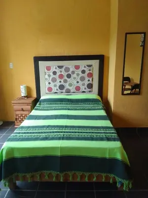 Cama o camas de una habitación en Hospedaje Casa Cortés - Recamaras de Descanso en Tepoztlán Mor