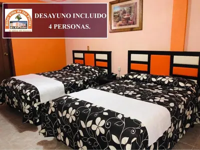 Cama o camas de una habitación en Hotel Villa De Las Flores