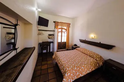 Cama o camas de una habitación en Hotel Posada Don Ramon