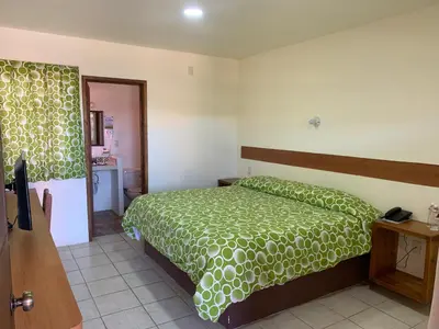 Cama o camas de una habitación en Hotel Posada Don Ramon
