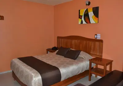 Cama o camas de una habitación en Hotel Márquez