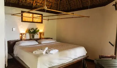 Cama o camas de una habitación en Hotel Bahía de la Luna