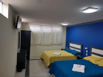 Cama o camas de una habitación en Hotel del Rosario