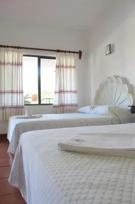 Cama o camas de una habitación en Hotel Albatros