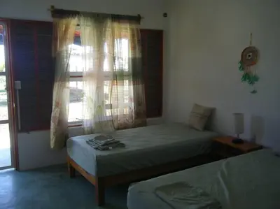 Cama o camas de una habitación en Casa Colibrí Agua Blanca