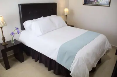 Cama o camas de una habitación en Hotel Nube Nueve