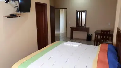 Cama o camas de una habitación en Hotel Alebrijes