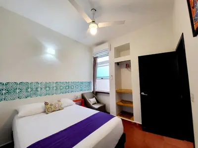 Cama o camas de una habitación en Casa Puerto Bonito, Aparthotel & Coworking