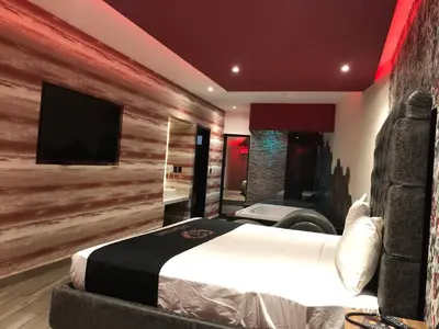 Cama o camas de una habitación en Intimisimo Suites Autohotel Centro Only Adult