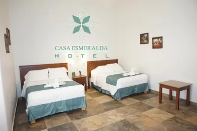 Cama o camas de una habitación en Casa Esmeralda Hotel
