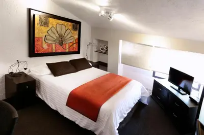Cama o camas de una habitación en Aztic Hotel and Executive Suites