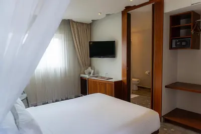 Cama o camas de una habitación en Flor de Mayo Hotel & Restaurant