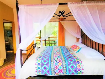 Cama o camas de una habitación en Hotel Boutique Jardín de Flores