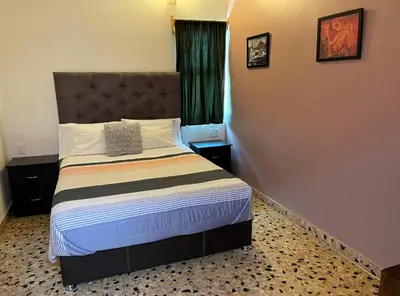 Cama o camas de una habitación en Alma mía - Hospedaje Cholula