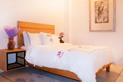 Cama o camas de una habitación en Hospedaje Donaji