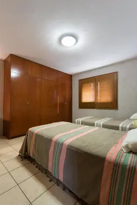 Cama o camas de una habitación en La Casita del Abuelo Bonita Casa de Cantera y Adobe