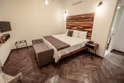 Cama o camas de una habitación en Hotel Tabáa Oaxaca