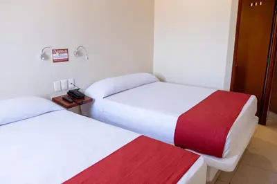 Cama o camas de una habitación en Mishol Bodas Hotel & Beach Club Acapulco Diamante