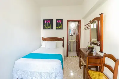 Cama o camas de una habitación en Hotel Casa Blanca