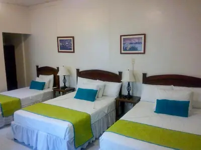 Cama o camas de una habitación en Hotel Casa Blanca