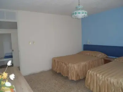 Cama o camas de una habitación en Suites Angelopolis