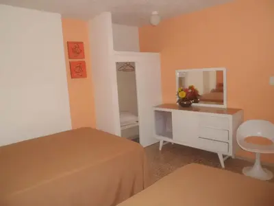 Cama o camas de una habitación en Suites Angelopolis