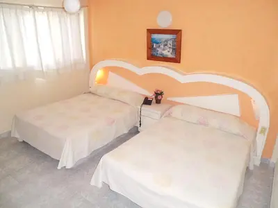 Cama o camas de una habitación en Suites Angelopolis