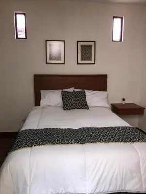 Cama o camas de una habitación en HOTEL CASA SILVESTRE