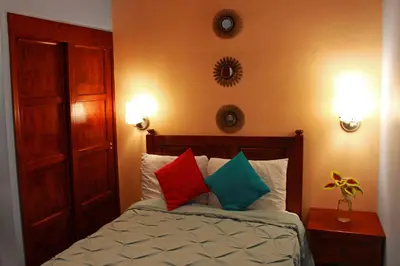 Cama o camas de una habitación en Las Mariposas Hotel & Studios