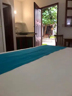 Cama o camas de una habitación en Las Mariposas Hotel & Studios