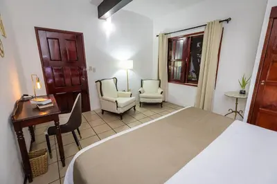 Cama o camas de una habitación en Las Mariposas Hotel & Studios