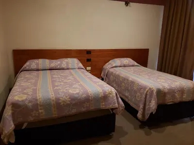 Cama o camas de una habitación en Hotel Edén