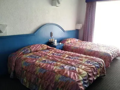 Cama o camas de una habitación en Hotel Inn Sur