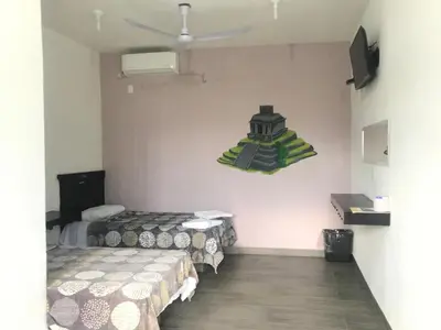 Cama o camas de una habitación en HOTEL LOS PINOS CENTRO