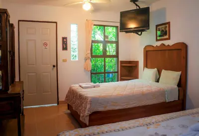 Cama o camas de una habitación en Hotel Hacienda Xico Inn