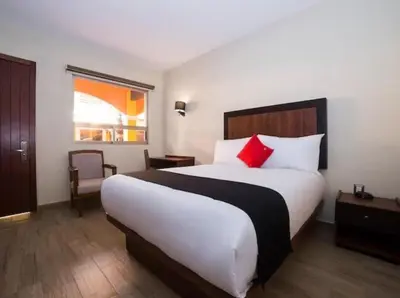 Cama o camas de una habitación en Hotel Colonial Acopinalco Inn