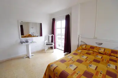 Cama o camas de una habitación en Hotel Castillo