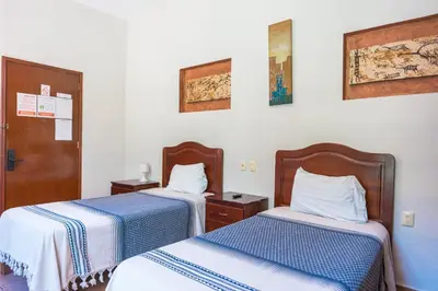 Cama o camas de una habitación en Hotel Don Nino