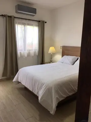 Cama o camas de una habitación en Hotel Concierge Flor y Canto