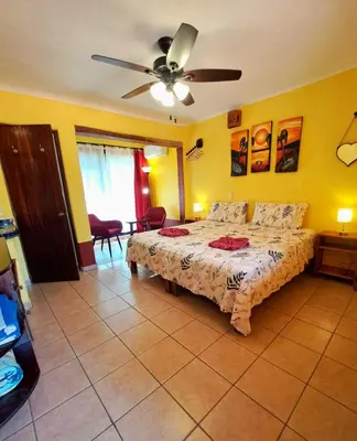 Cama o camas de una habitación en HOTELITO SWISS OASIS, Playa Zicatela - Adults Only - Kitchen - Cocina