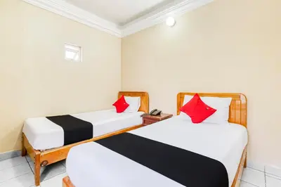 Cama o camas de una habitación en Capital O Colina Dorada