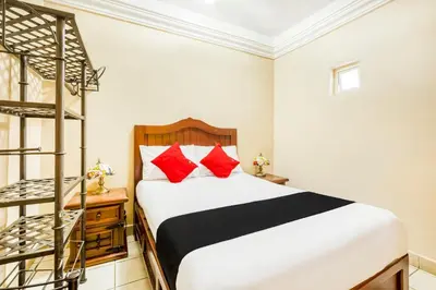 Cama o camas de una habitación en Capital O Colina Dorada