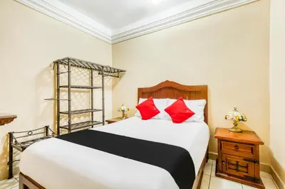 Cama o camas de una habitación en Capital O Colina Dorada