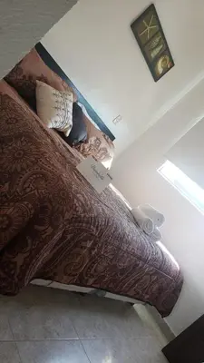 Cama o camas de una habitación en DEPA 100 POR CIENTO FAMILIAR ACAPULCO CERCA DEL MAR CON ROFF GARDEN y JACUZZI