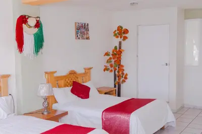 Cama o camas de una habitación en Hotel Carnaval