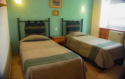 Cama o camas de una habitación en Posada de los Angeles