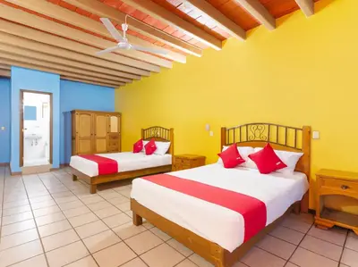 Cama o camas de una habitación en Hotel Posada San Rafael