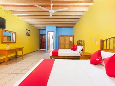 Cama o camas de una habitación en Hotel Posada San Rafael