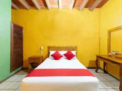 Cama o camas de una habitación en Hotel Posada San Rafael